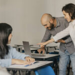 Consultants using the AND Digital HowNow platform for skills-based training and onboarding.